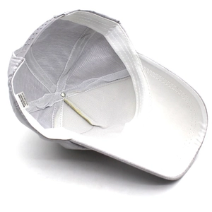 Inside view of light gray paper straw baseball cap with white sweatband and plastic strap