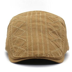 Close-up of khaki cotton ivy cap featuring intricate embroidered geometric stitching details