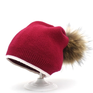 Bonnet d'Hiver en Tricot pour Femme Imitation Cachemire Chaud Coupe-Froid avec Grand Pompon en Fourrure de Raton Laveur Accessoire Mode