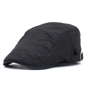 Detail of adjustable metal buckle and breathable mesh fabric on black camo ivy cap