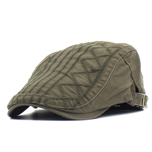 Detail view of military green cotton beret featuring fine stitching and adjustable metal buckle