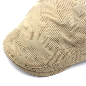 Detailed macro view of khaki breathable mesh fabric and double stitching on the flat cap