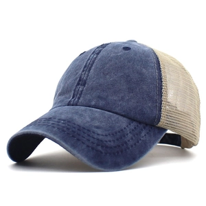Detail of vintage navy blue washed cotton cap with breathable beige mesh back