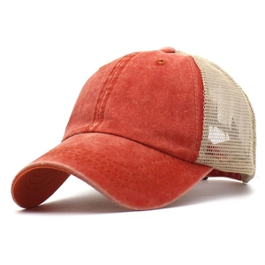 Detail of vintage washed canvas trucker hat with breathable mesh and reinforced stitching