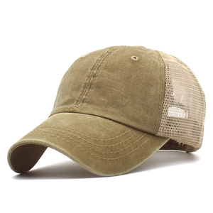 Detail of vintage mesh trucker hat with washed khaki canvas and breathable net back