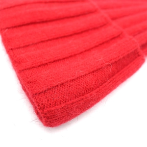 Solid red knit beanie for women made of soft faux rabbit fur with ribbed texture