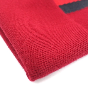 Red ribbed knit beanie hat for men and women featuring warm cashmere texture and stripes