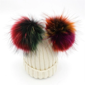 Women's cream wool knit beanie with colorful dual faux fur pom poms for winter fashion