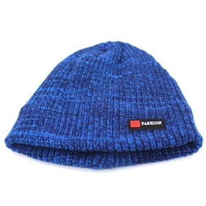 Detail of navy blue ribbed knit beanie with FS FASHION patch and warm fleece texture