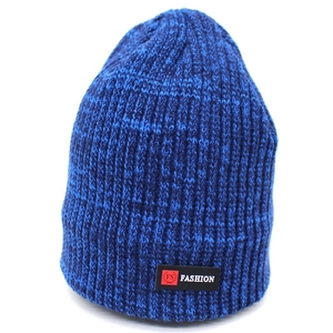 Detail of blue marl ribbed knit beanie featuring a black woven fashion logo patch