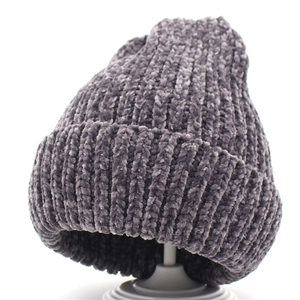 Detail of grey chenille knitted beanie with ribbed texture and classic folded cuff design
