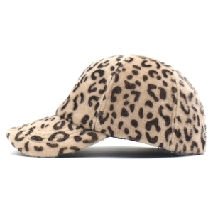 Detailed side view of plush leopard print baseball cap with fuzzy faux fur texture
