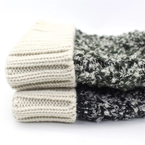 Women's thick knit wool hat with pompom for winter warmth in mixed color patterns