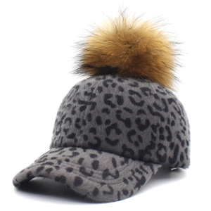 Women's leopard print baseball cap with faux fur pom-pom and gray wool-like texture