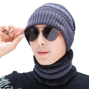 Detail of gray winter knit beanie with soft fleece lining and matching neck warmer set