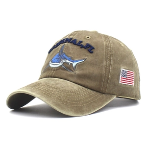 Detail of shark embroidery and American flag patch on washed cotton baseball cap