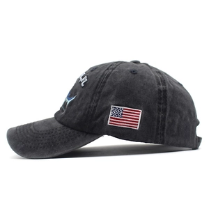 Washed cotton baseball cap in charcoal gray with shark embroidery and American flag patch