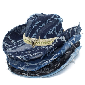 Stacked denim cowboy hats with frayed edges and silver bull head metal accessory