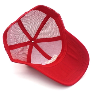 Detailed interior view of red trucker cap showing mesh back and six-panel structure