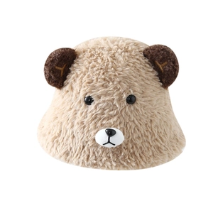 Detailed close-up of cute plush bear bucket hat with soft beige fleece and ears