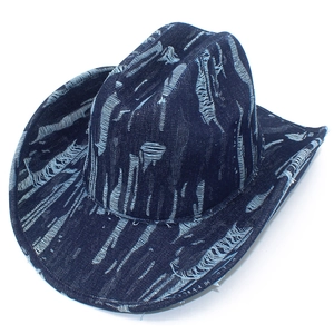 Close-up of distressed denim cowboy hat with frayed texture and vintage blue finish