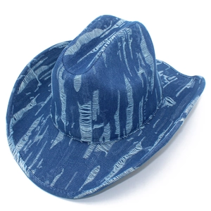 Close-up of distressed denim cowboy hat with laser-cut ripped textures and a bull head accent