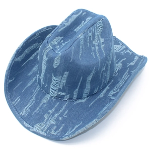Close-up of distressed blue denim western cowboy hat with vintage ripped textures