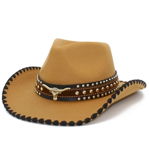 Detail of camel wool cowboy hat with bull head ornament and silver studs on leather band