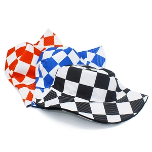 Detailed view of reversible checkered bucket hats in red, blue, and black grid patterns