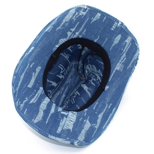 Interior view of denim cowboy hat with black sweatband and adjustable wind rope strap
