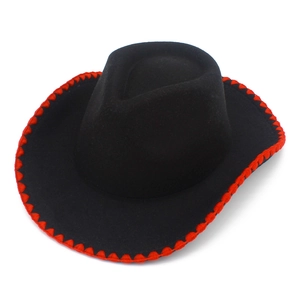 Detail of black felt cowboy hat featuring distinctive red zigzag stitching on the brim edge