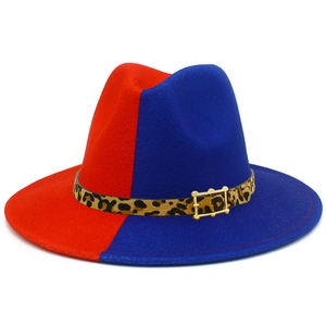 Detail of red and blue wool fedora hat featuring leopard print band and gold buckle