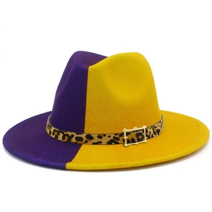 Detail of two-tone fedora hat with purple and yellow felt and leopard print buckle belt