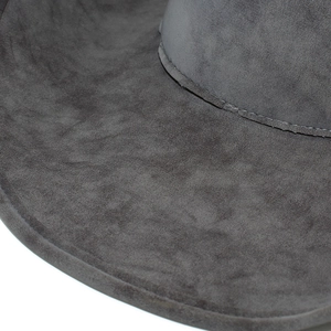 Detailed view of heavy stitching on a dark grey wide-brimmed western cowboy hat