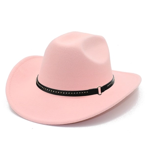 Detailed close-up of a pink felt cowboy hat featuring a black belt with gold studs