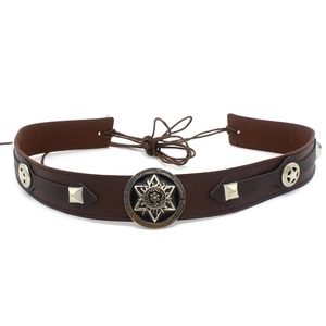 Close-up of brown leather band with hexagonal star emblem and silver cone rivets