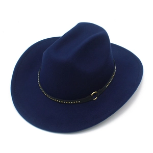 Detailed close-up of navy blue wool fedora hat with gold studded leather band belt
