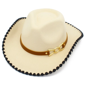 Detail of cream felt cowboy hat with decorative wavy stitching and golden buckle band