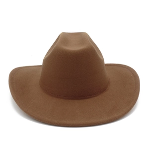 Detail of classic brown western cowboy hat with wide brim and stitched leather belt accessory