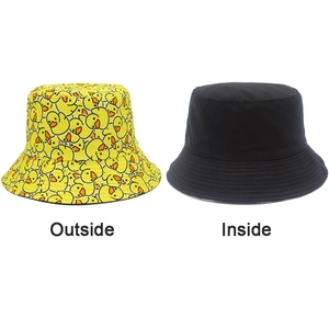 Reversible bucket hat detail showing yellow cartoon duck print and plain black lining side