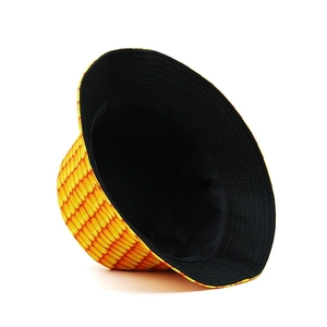 Detailed view of yellow corn print bucket hat with reversible black lining and fine stitching