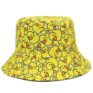 Reversible yellow bucket hat with cartoon duck prints for sun protection and style