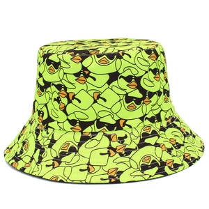 Detail of neon green bucket hat with cartoon duck prints and fine white stitching