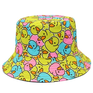 Double-sided bucket hat featuring cute yellow cartoon duck prints on a white background