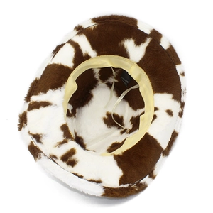 Detail view of the plush interior lining and washing label of the cow print cowboy hat
