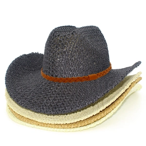 Detail view of woven hollow cowboy hats in dark grey, khaki, and beige straw textures
