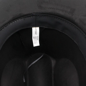 Detail view of the black fedora interior with 100% polyester wash label and sweatband