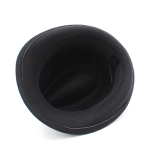 Detail view of the black trilby hat interior showing size 57 label and 100% polyester fabric