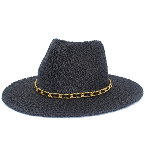 Elegant black woven straw sun hat for couples with a stylish gold chain trim accent