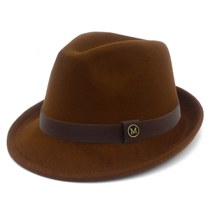 Close-up of the vintage dark brown wool fedora with leather band and gold metal M logo
